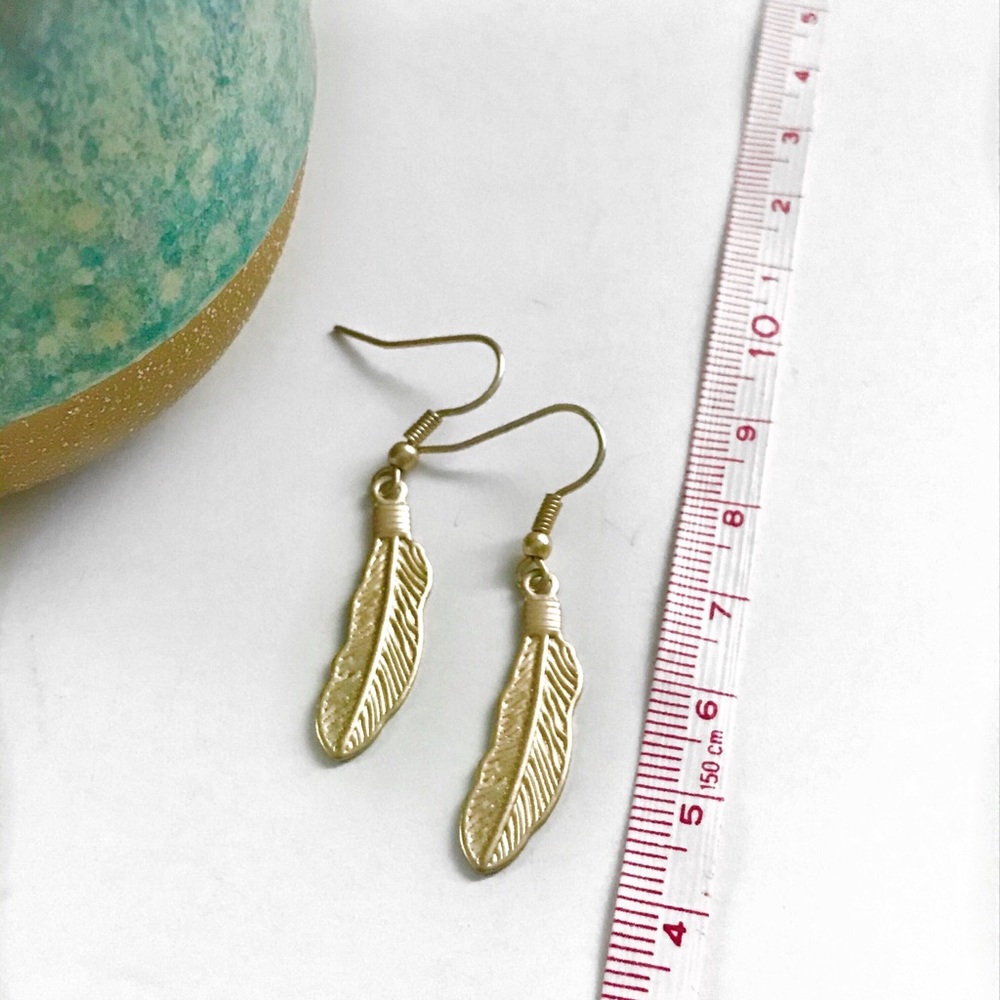 Gold feather earrings